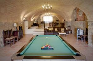 a pool table in the middle of a room at Can Llobet in Capmany