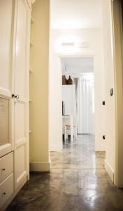 a hallway with an open door and a dining room at Lughia in Tortolì