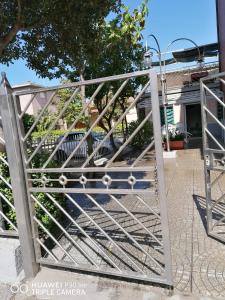 a gate in front of a house at Hausemaremma 1 camera in Follonica +3 photos
