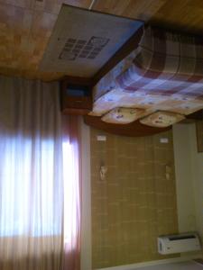 a bedroom with two bunk beds on the ceiling at Pallada Motel in Pasiky-Zubryts'ki