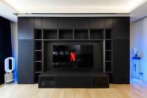TV a/nebo společenská místnost v ubytování Shibuya City House 渋谷シティハウス + 34 fotografií