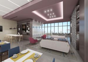 a rendering of a living room and dining room at Courtyard by Marriott Suwon in Suwon