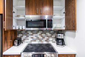 a kitchen with a stove and a microwave at Downtown 1BR w Doorman nr Disney Hall LAX-33 in Los Angeles