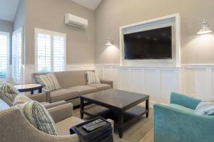 a living room with couches and a flat screen tv at Foster City 2br w gym pool wd nr shops SFO-1293 in Belmont