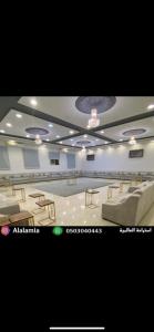 a large room with tables and chairs in it at استراحة العالمية alalamia resort in Taif