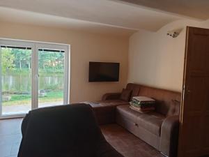 Ruang duduk di Cosy house for relaxing and sightseeing