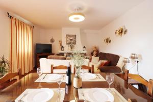 a living room with a table and chairs and a couch at Villa el Barco Spainsunrentals 1200 in Nerja