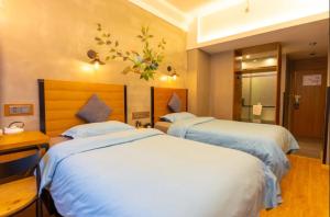 Katil atau katil-katil dalam bilik di Gongxili - Chujian Hotel