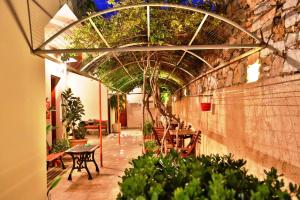 A garden outside Ventoura Studios & Apartments