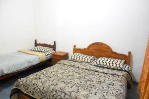 Postel nebo postele na pokoji v ubytování Pedro Resort & Bungalow Nuwara Eliya