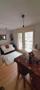 a bedroom with a bed and a table in it at Appartement vue montagne proximité ski et parcours TMB in Les Contamines-Montjoie