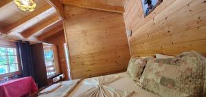Postel nebo postele na pokoji v ubytování Hotel Panorama Dajt