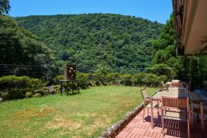 a patio with a view of a mountain at 箱根湯本ホテル in Hakone