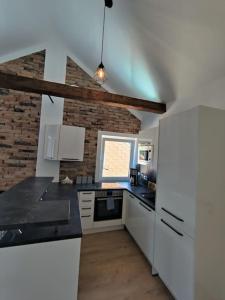Kuchyň nebo kuchyňský kout v ubytování Amstetten Penthouse