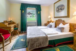 Postel nebo postele na pokoji v ubytování Hotel Gasthof Adler