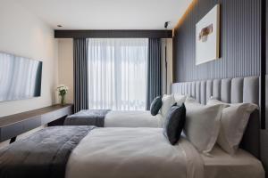 Voodi või voodid majutusasutuse Derand Hotel toas