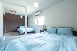 Ένα ή περισσότερα κρεβάτια σε δωμάτιο στο Furano Retreat