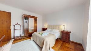 Postel nebo postele na pokoji v ubytování Azores Quinta da Cruzinha