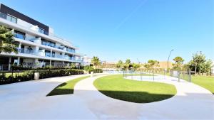 a walkway in front of a building at AA Guest - Luxury Paradise Eco Apartment Higueron in Fuengirola