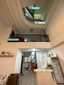 a view of a room with a staircase in a building at Kong Khong Homestay in Hat Yai