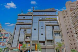a building with a sign on top of it at HOTEL LEE PLATINUM in Ahmedabad