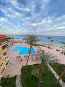 an aerial view of a resort with a pool and the ocean at Luxury large Apartment 2 bedroom all rooms with amazing sea view in Hurghada