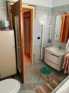 a bathroom with a sink and a toilet at Casa Appennini in Licata
