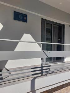 a balcony of a building with a window at P&K LUXURY APARTMENTS 1 in Kalamata