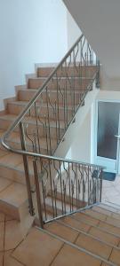 a metal railing on a staircase in a house at Cazare Hofmann in Arad