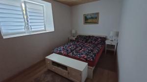 Tempat tidur dalam kamar di Sunny House