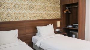 Katil atau katil-katil dalam bilik di Pakons Prime Hotel