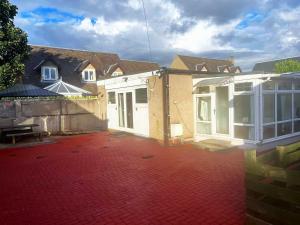 a house being remodeled with a red brick patio at Elegant 2 Bedroom Chalet in Edinburgh