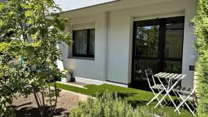 a table and chairs in front of a house at Casa Giona in Trento