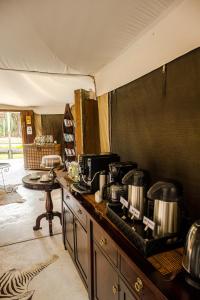 a kitchen with pots and pans on a counter at Taranga Safari Lodge in Rundu