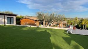 a shadow of a person on a lawn at Cocus in Ravanusa