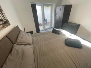 a bedroom with a bed with two pillows on it at Cosy 1 bedroom apartment in the centre of Bolsover in Chesterfield