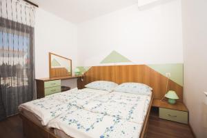 Кровать или кровати в номере Apartmani Nada & Darko, Kampor, Rab, Hrvatska