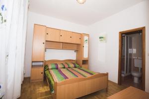 Кровать или кровати в номере Apartmani Nada & Darko, Kampor, Rab, Hrvatska