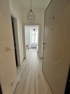 a hallway with a door leading to a room at Luxury apartment + garage in Trieste +6 photos