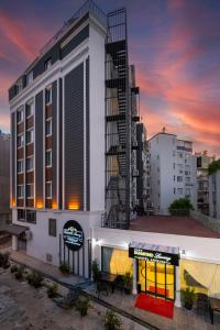un edificio con un cartel en el costado en DIAMOND luxury Hotel, en Antalya
