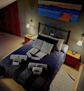 a bedroom with a bed with pillows on it at RINCON DO MAR ATC DH in A Guarda