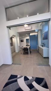 a room with a large glass door with a table at Case vacanze Cappero e Malvasia in Canneto