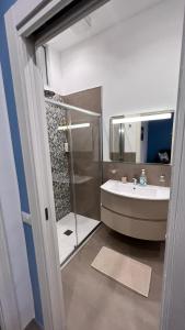 a bathroom with a glass shower and a sink at Case vacanze Cappero e Malvasia in Canneto +48 photos