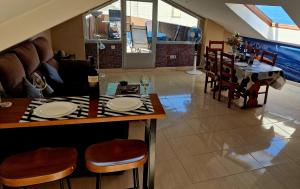 a kitchen and dining room with a table and chairs at RINCON DO MAR ATC DH in A Guarda