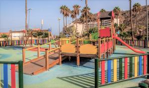 a playground at a park with a slide at Tenerife Flamingo in Palm-mar