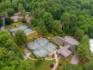 an overhead view of a golf estate with two tennis courts at Sylvan Falls at Yonahlossee in Blowing Rock