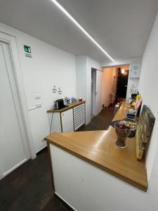 a kitchen with a wooden counter top in a room at Popolo Dream Suites - Luxury Rooms in Rome