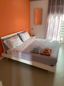 a bedroom with a bed with two books on it at Agriturismo I Tassoni in Pavullo nel Frignano