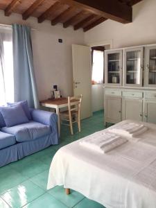 Кровать или кровати в номере Belvedere Residenza Mediterranea