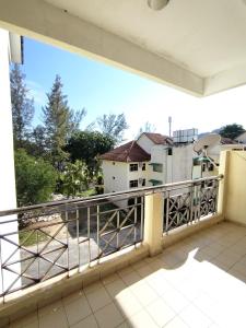 a balcony with a view of a building at Teluk Batik Holiday Apartment in Lumut +56 photos